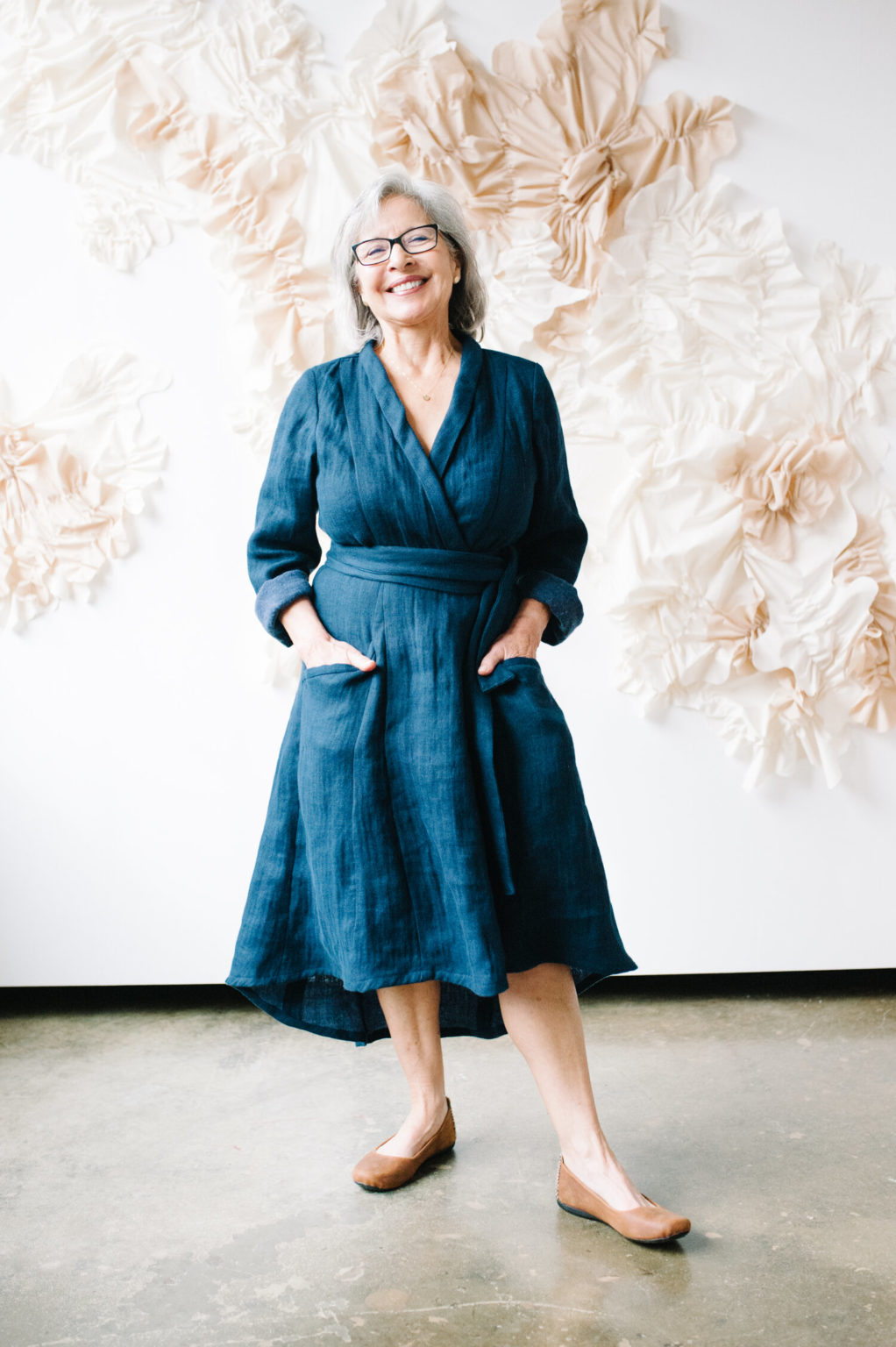 Pam wear a blue Lichen Duster