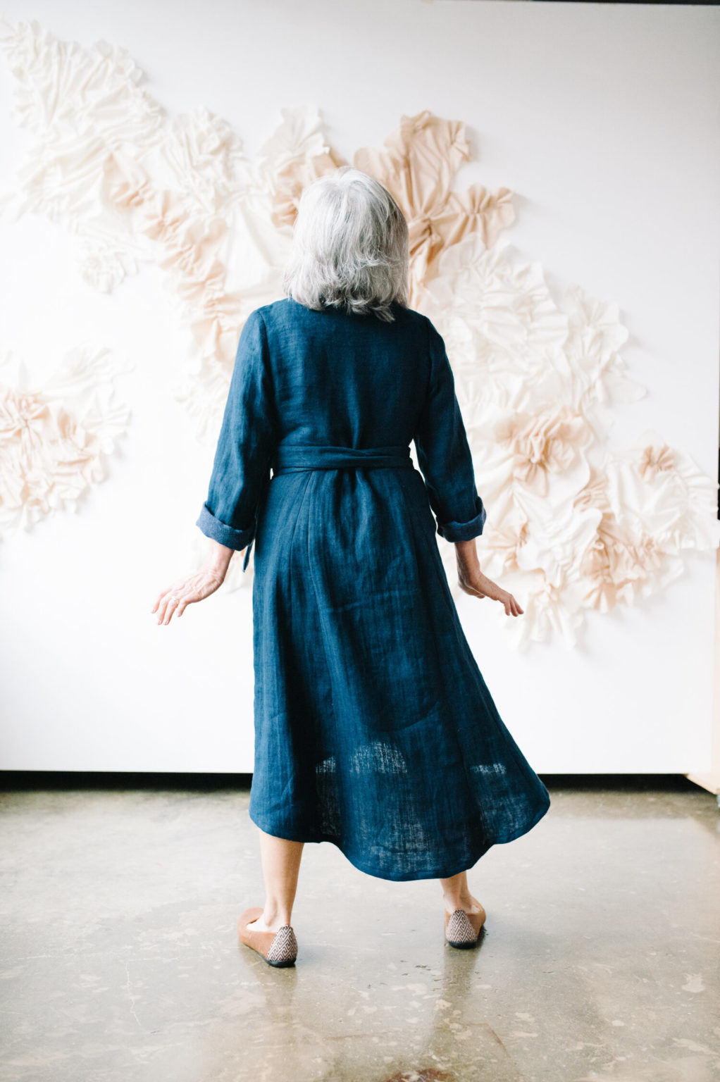 Pam shows off the back of a blue Lichen duster