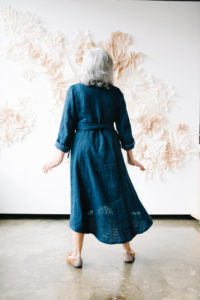 Pam shows off the back of a blue Lichen duster