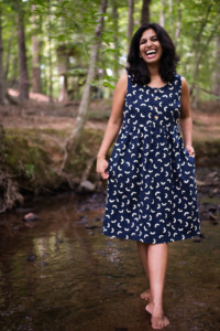 Sophia wears a navy printed sleeveless Hinterland dress
