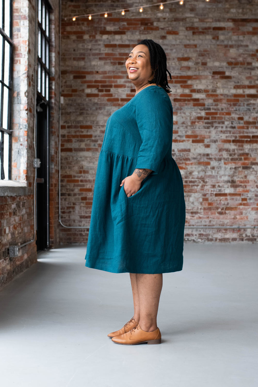Ashley wears a teal Hinterland Dress