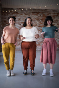 Meg, Sudi-Laura and Meredith wearing Bedrock Tees