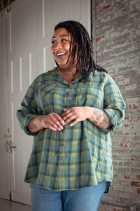 Ashley wearing a green plaid view b joanie top