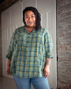 Ashley wearing a green plaid view b joanie top