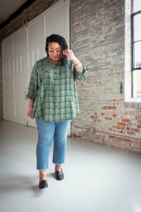 Ashley wearing a green plaid view b joanie top