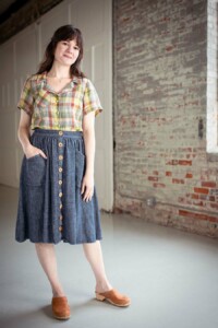 Meredith wearing a pastel plaid view a joanie top