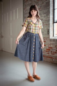 Meredith wearing a pastel plaid view a joanie top