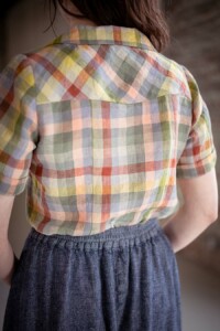 Meredith wearing a pastel plaid view a joanie top