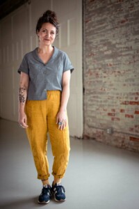 Meg wearing a grey chambray joanie top