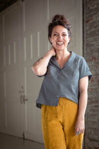 Meg wearing a grey chambray joanie top