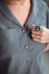 Meg wearing a grey chambray joanie top