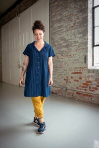 Meg wearing a blue, dress length version of the Joanie Top