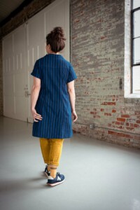 Meg wearing a blue, dress length version of the Joanie Top