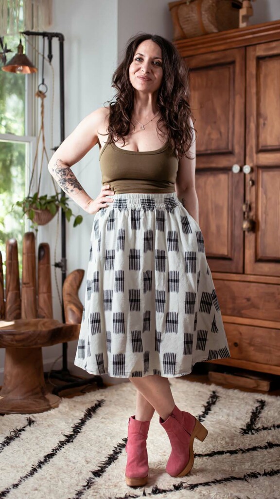 Meg is wearing a cotton ikat gypsum skirt and pink boots.