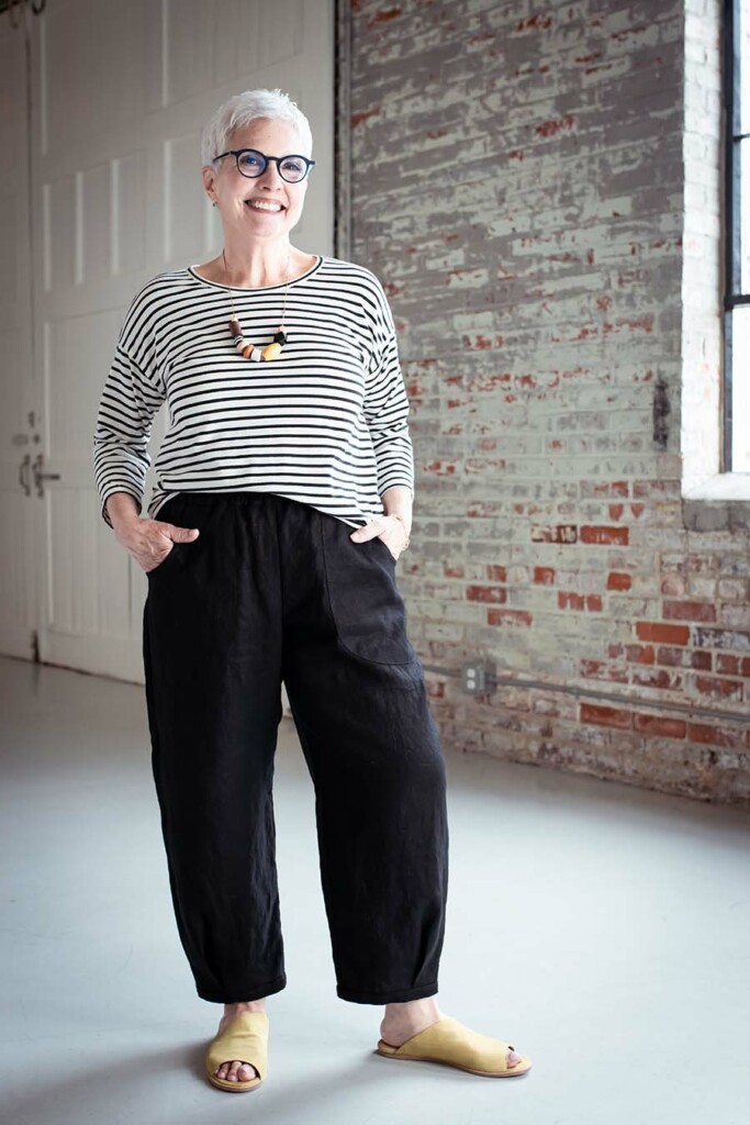 Learn to Fit and Sew Pants 3 Cindy wears black chanterelle pants and a striped top