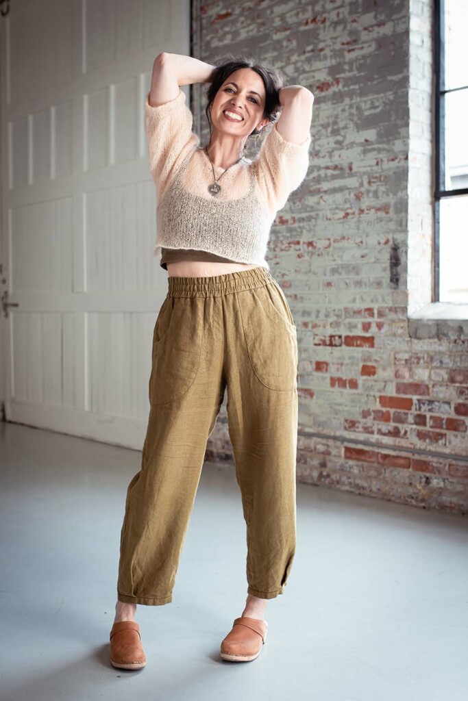 Fabric and Fit for the Chanterelle Pants 2 Meg wears olive chanterelle pants and a fuzzy cream top