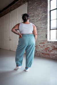 Ashley wears a crop top and blue chanterelle pants