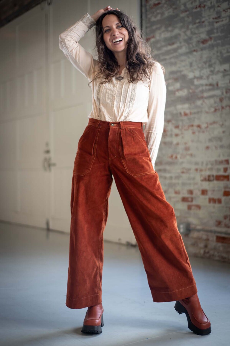 Meg wears red view a Pinyon Pants