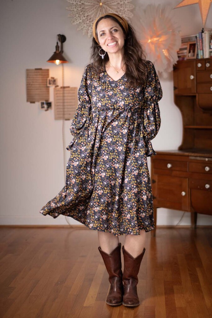 Meg wears a floral, long sleeve, view b ember dress