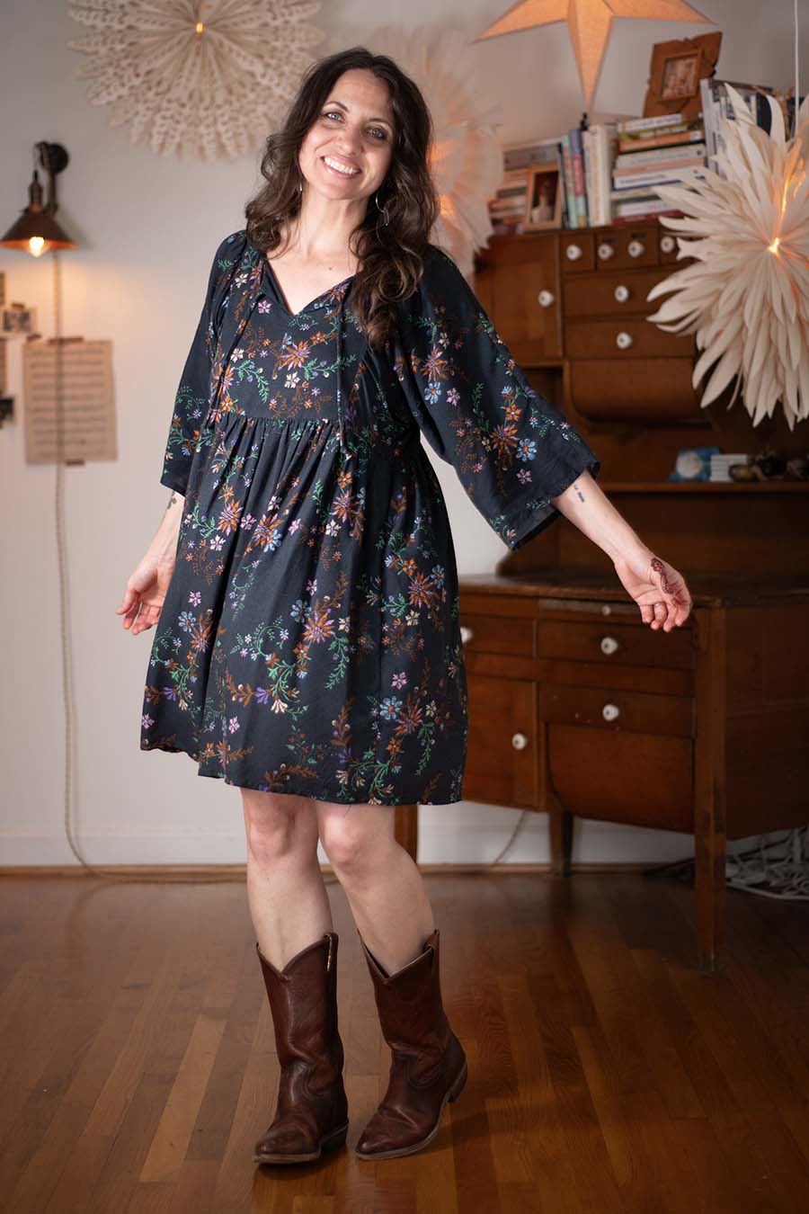 Meg wears a black floral Greenbrier Dress