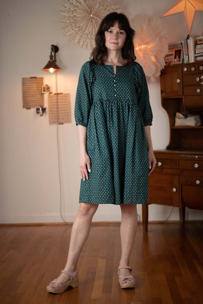 Meredith wears a green Greenbrier Dress
