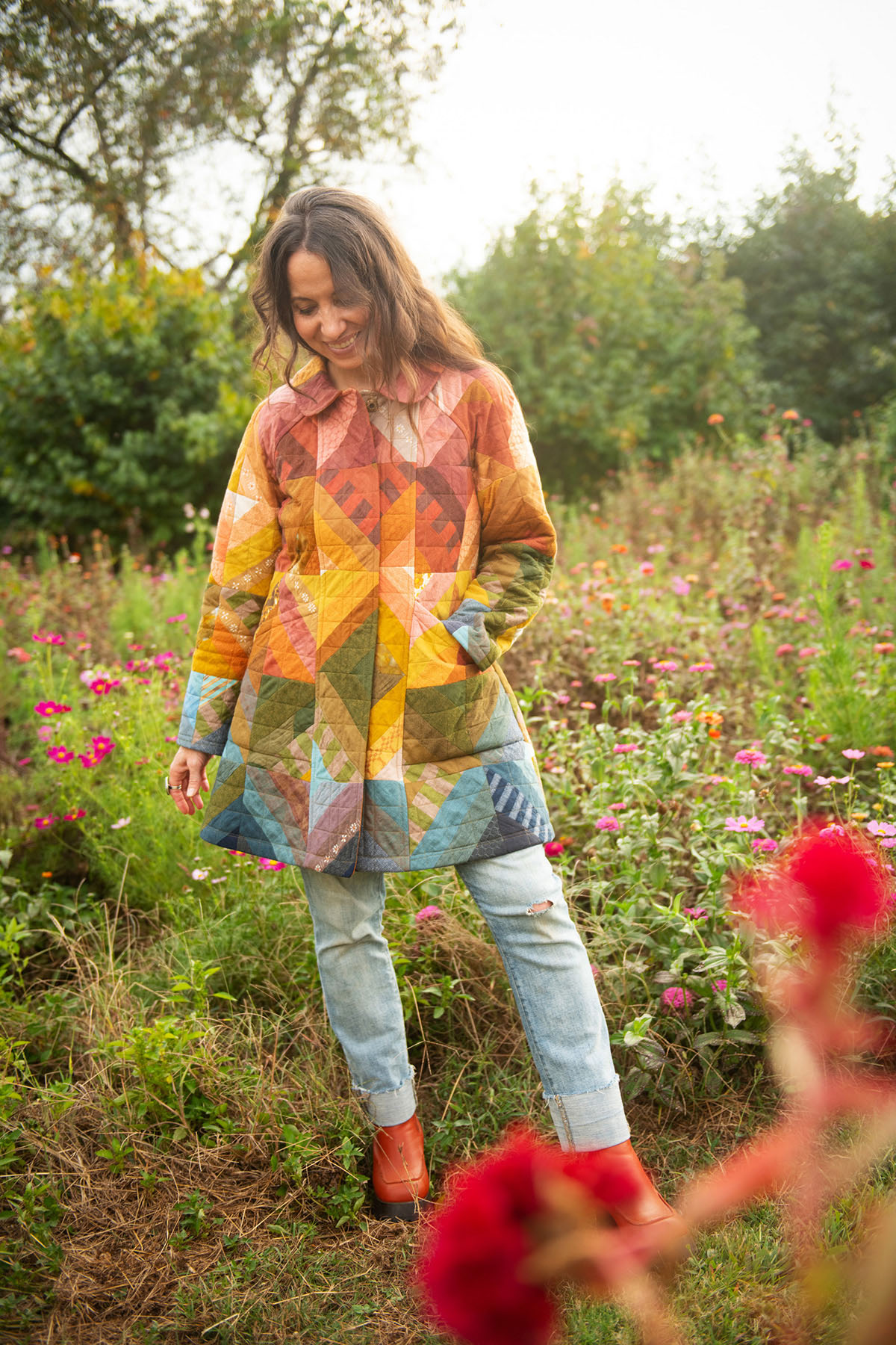Meg wearing a rainbow retazo coat