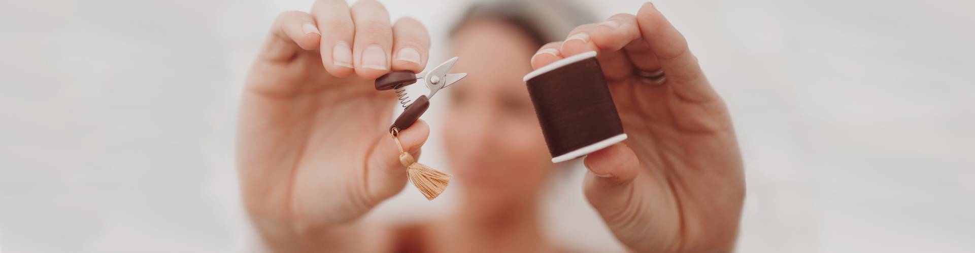 Meg McElwee holding sewing snips and thread